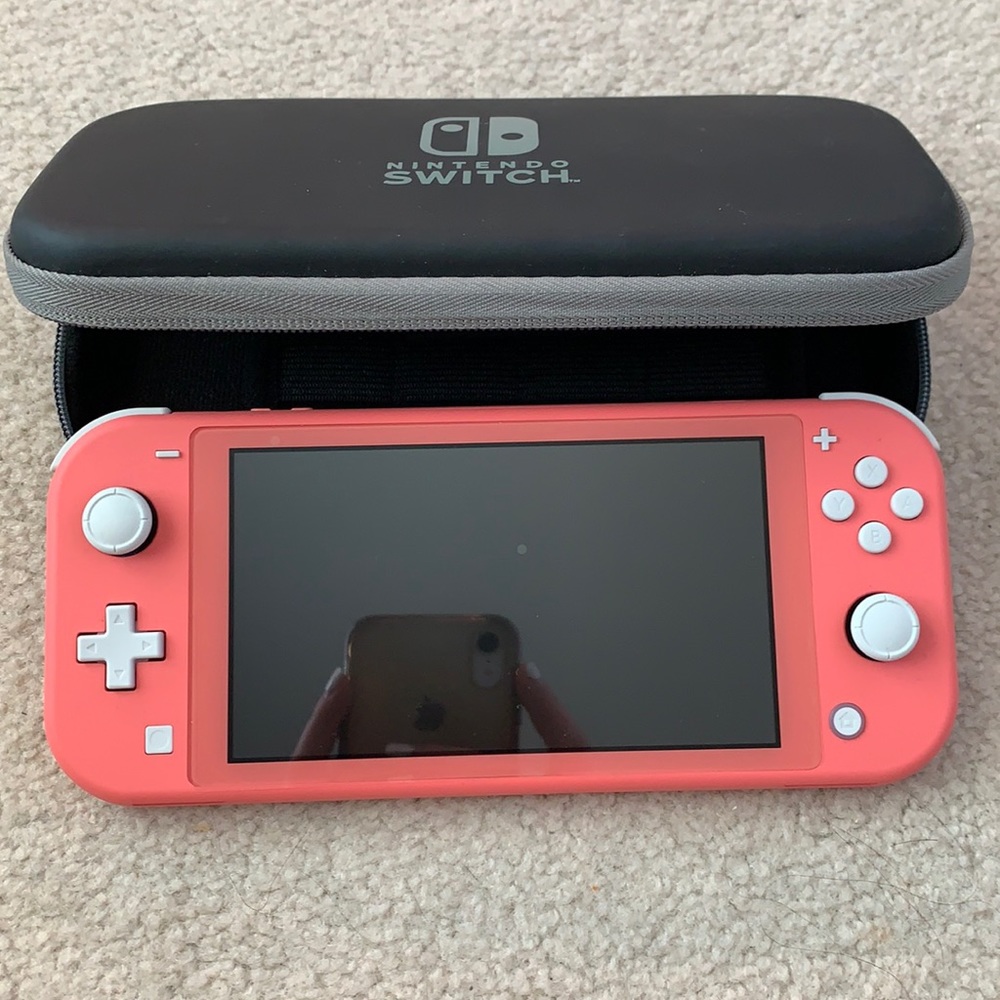 BARELY TOUCHED, Nintendo Switch lite- coral color- with brand new case!